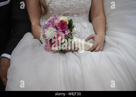 Bridal bouquet of flowers in hands of the bride. Wedding concept Stock Photo