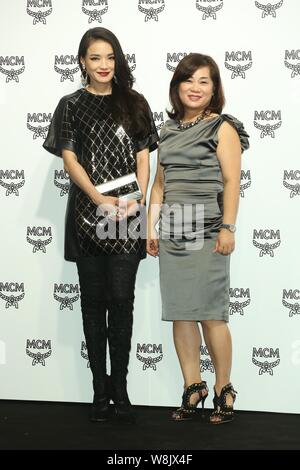 Taiwanese actress Shu Qi, left, poses during the opening ceremony for an MCM boutique in Taipei, Taiwan, 16 October 2015.