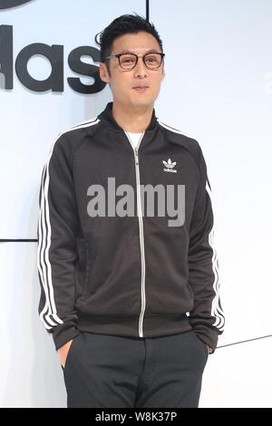Hong Kong singer and actor Shawn Yue smiles during a press conference for Adidas sportswear in Taipei, Taiwan, 16 January 2015. Stock Photo