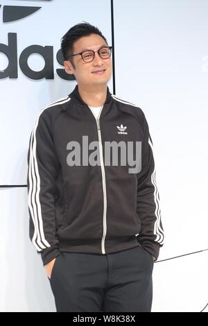 Hong Kong singer and actor Shawn Yue smiles during a press conference for Adidas sportswear in Taipei, Taiwan, 16 January 2015. Stock Photo