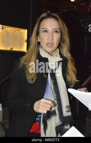 Hong Kong-born American singer Coco Lee is interviewed as she feasts British singer Rita Ora at her restaurant in Hong Kong, China, 22 March 2016. Stock Photo