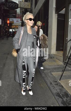 British singer Rita Ora, front, arrives at a restaurant of Hong Kong-born American singer Coco Lee in Hong Kong, China, 22 March 2016. Stock Photo