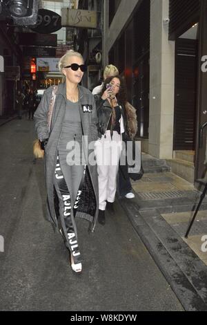 British singer Rita Ora, front, arrives at a restaurant of Hong Kong-born American singer Coco Lee in Hong Kong, China, 22 March 2016. Stock Photo