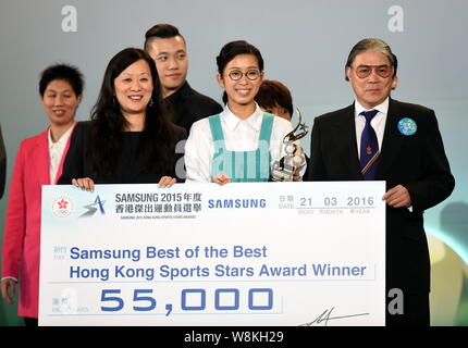 Hong Kong tycoon Timothy Fok Tsun-Ting, right, poses with Hong Kong snooker player Ng On Yee, center, during the 2015 Hong Kong Sports Star Awards in Stock Photo