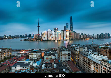 --FILE--A panoramic night view of buildings near the Bund along the Huangpu River in Puxi and the Lujiazui Financial District with the Shanghai Tower, Stock Photo