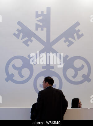 --FILE--A logo of UBS is pictured at the front desk during the UBS Greater China Conference 2012 in Shanghai, China, 10 January 2012.   A slowdown in Stock Photo