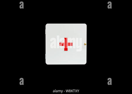 Isolated White first aid medicine cabinet on a black background with clipping path. Stock Photo