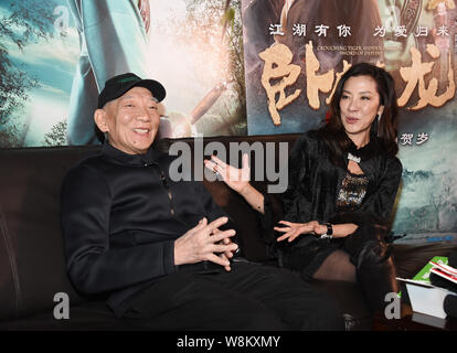 Malaysian actress Michelle Yeoh, right, and Hong Kong director Yuen Woo-ping attend a press conference for the premiere of their new movie 'Crouching Stock Photo