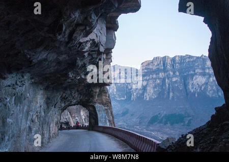 View of a cliff tunnel in Jingdi village, Pingshun county, Changzhi city, north China's Shanxi province, 2 January 2016.   A cliff tunnel was built by Stock Photo