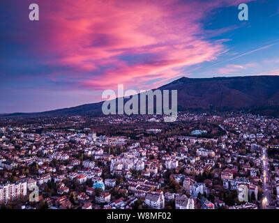 Beautiful aerial shot over Sofia, Bulgaria - amazing weather, colorful skies, perfect sunset over busy streets - impressive cityscape Stock Photo