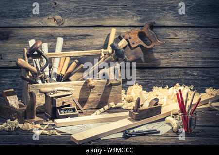 Vintage carpenter working tools on rustic wooden table Stock Photo