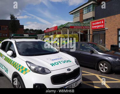 Doctors car at the A&E Dept, The Royal Bolton Hospital, with North West Ambulance Service vehicles, Bolton, Lancashire, Greater Manchester, England UK Stock Photo