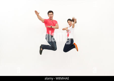 Young couple jumping in air Stock Photo