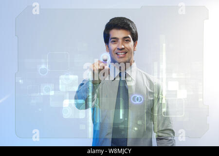 Businessman using a touch screen Stock Photo