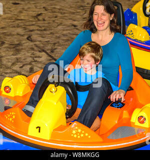 Scooter driving with the kids in indoor playground Stock Photo