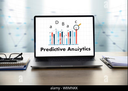 Predictive Analytics Businessman working at office desk and using computer and objects, coffee, top view, Stock Photo