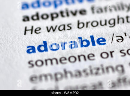 MONTREAL, CANADA - JULY 17, 2019: adorable word in a dictionay with meaning. Close-up and selective focus. Stock Photo