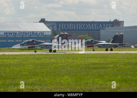 ZHUKOVSKY, RUSSIA - JULY 20, 2017: Two Su-30SM  multipurpose  fighters on the runway of Zhukovsky airport on a summer day. Fragment of the MAKS-2017 a Stock Photo