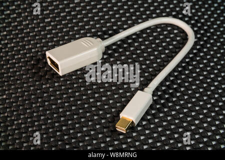 Mini male DisplayPort to female DisplayPort cable and adapter Stock Photo