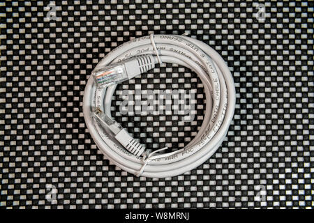 Gray lan cable and connector on black and white background Stock Photo