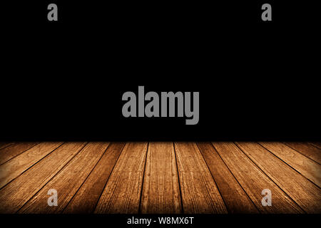 Empty wooden table isolated on black background Stock Photo