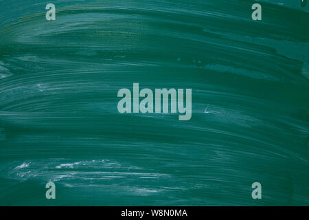 Green smudged chalkboard texture close up Stock Photo