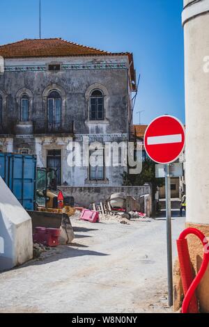 Old Portuguese street. Classic architecture and church from Portugal. Vintage cultural style. Stock Photo
