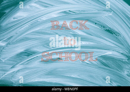 Green smudged chalkboard with the back to school sign Stock Photo