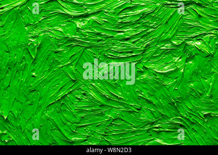 Abstract close-up painted background. Background was painted with green oil color on canvas by hand. Stock Photo