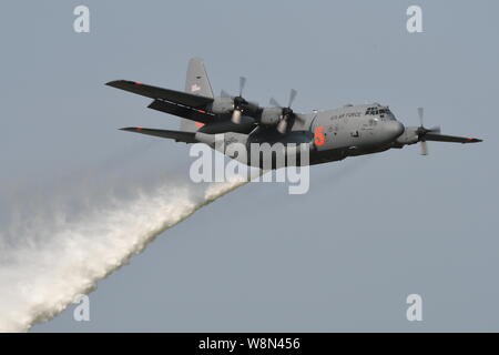 FIREFIGHTING - U.S. AIR FORCE C-130H HERCULES WATER DROP. Stock Photo