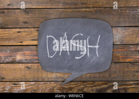 Word, inscription DASH written in chalk on a blackboard made in the form of thought. Top view. Stock Photo