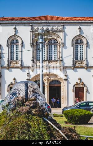 Old Portuguese street. Classic architecture and church from Portugal. Vintage cultural style. Stock Photo