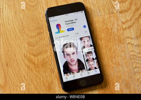 FaceApp on the Apple App Store. FaceApp uses artificial intelligence to generate face transformations from photographs Stock Photo