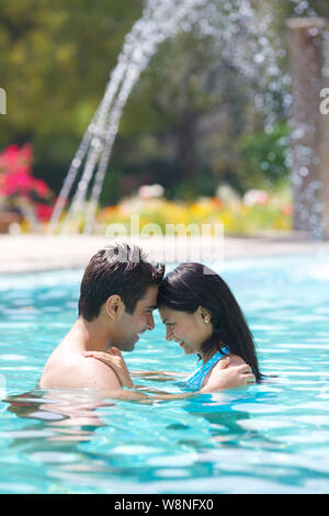 Side view of romantic young couple embracing in swimming pool | Pool  photography, Beach pictures friends, Swimming photography