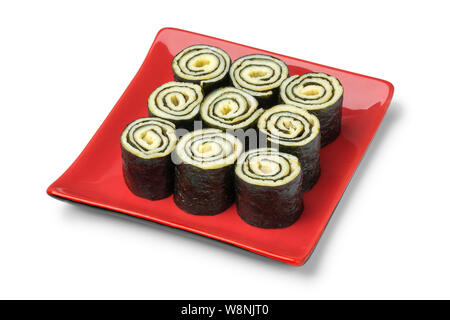 Dish with traditional Japanese egg rolls with nori isolated on white background Stock Photo