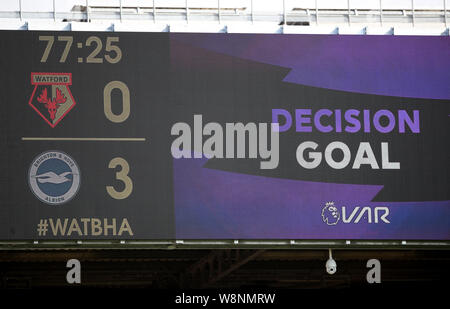 A view of the big screen with the Video Assistant Referee (VAR) decision after Brighton and Hove Albion's third goal during the Premier League match at Vicarage Road, Watford. Stock Photo