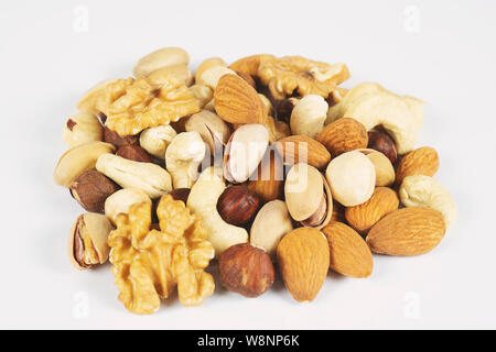 Mix nuts and dry fruits on a white background Stock Photo