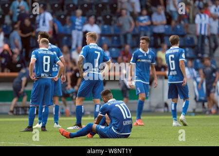 Magdeburg, Germany. 10th Aug, 2019. Soccer: DFB Cup, 1st FC Magdeburg - SC Freiburg, 1st round in the MDCC-Arena in Magdeburg. Magdeburg's players stand on the grass after the game. Credit: Peter Steffen/dpa - IMPORTANT NOTE: In accordance with the requirements of the DFL Deutsche Fußball Liga or the DFB Deutscher Fußball-Bund, it is prohibited to use or have used photographs taken in the stadium and/or the match in the form of sequence images and/or video-like photo sequences./dpa/Alamy Live News Stock Photo