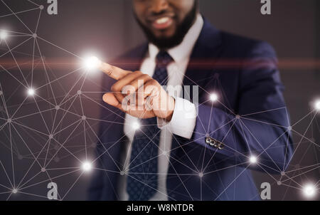 Man touching network connections at lightning point Stock Photo