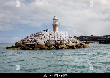 The lighthouse at the end of Brixham Breakwater in Devon Stock Photo