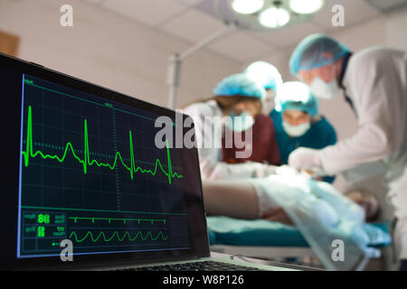 Monitoring of ECG and saturation O2 in the patient in the operating room. Stock Photo