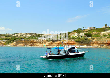 Tourists on a motorboat in Anissaras a travel destination in Crete the largest and most populated of the Gre Stock Photo