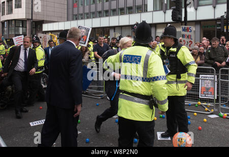 Peter Street, Manchester, UK. 5th October 2015. Anti-Tory protesters shout abuse and throw plastic balls at Boris Johnson and other delegates at the e Stock Photo