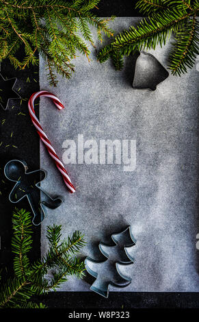 Christmas cooking concept with flour, brown sugar, nuts, cinnamon and anise star on wooden background Stock Photo