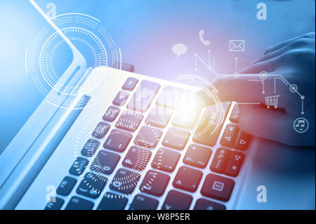 Woman hand touching laptop computer keyboard Stock Photo
