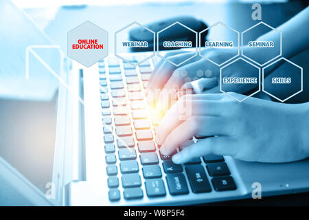 Close-up of typing female hands on keyboard. Online education concept Stock Photo