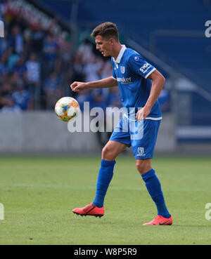 Magdeburg, Germany. 10th Aug, 2019. Soccer: DFB Cup, 1st FC Magdeburg - SC Freiburg, 1st round in the MDCC Arena. Magdeburg's Tobias Müller is on the ball. Credit: Peter Steffen/dpa - IMPORTANT NOTE: In accordance with the requirements of the DFL Deutsche Fußball Liga or the DFB Deutscher Fußball-Bund, it is prohibited to use or have used photographs taken in the stadium and/or the match in the form of sequence images and/or video-like photo sequences./dpa/Alamy Live News Stock Photo