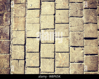 Ancient street pavement made of square blocks of wood Stock Photo