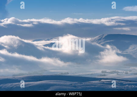 Bank of freezing fog covering the Howgill Fells on a winters afternoon, Cumbria, UK. Stock Photo