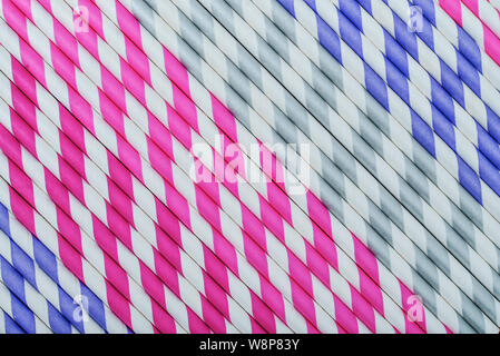 Background of Striped drink straws in different colors Stock Photo